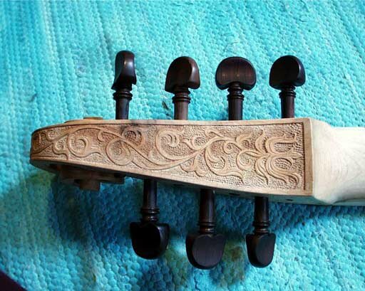 scroll and pegbox with bass relief