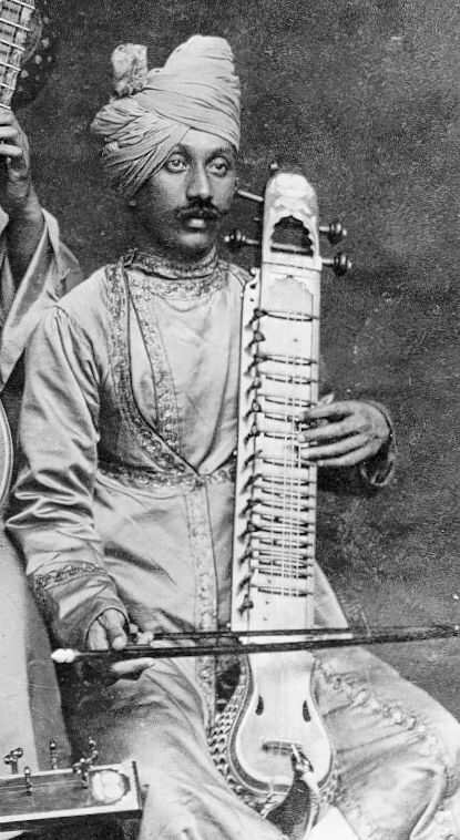 Indian musician with a Mayuri veena or Taus